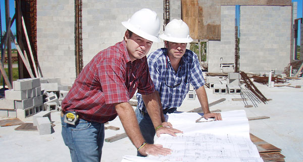 Ignacio and Alejandro Abascal on a construction site.